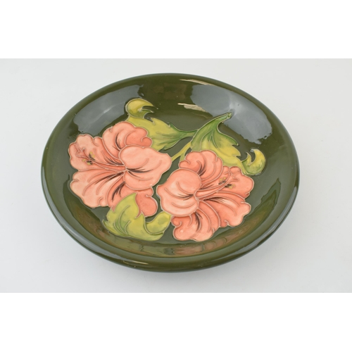 206 - Moorcroft Hibiscus on Green shallow bowl, 21.5cm diameter.