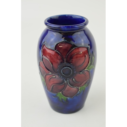 207 - Moocroft Hibiscus on blue vase, 10.5cm tall.