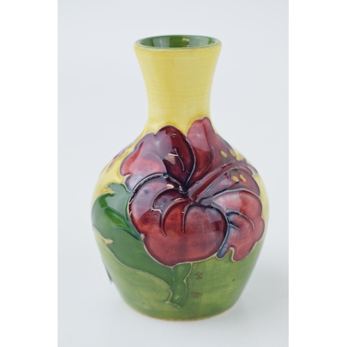 208 - Early Moorcroft vase on yellow and green background, 9cm tall.