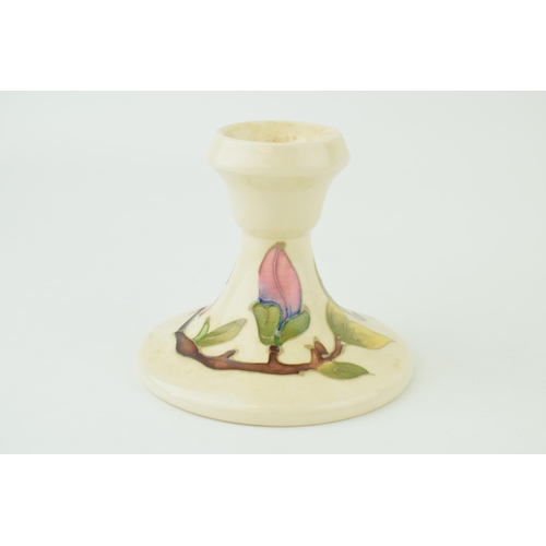 211 - Moocroft pink on magnolia candlestick, 8.5cm tall.