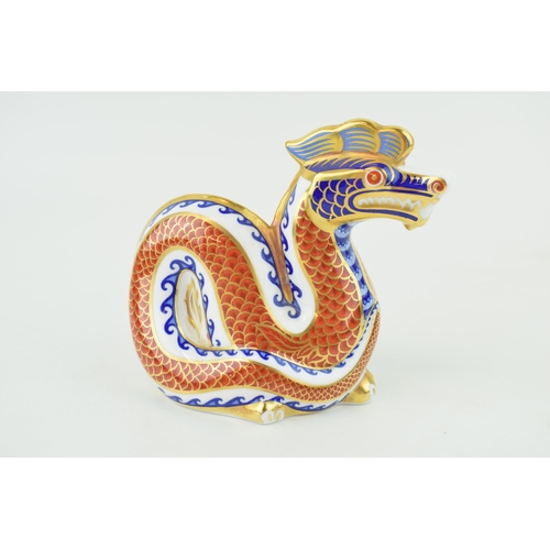 228 - Royal Crown Derby Dragon paperweight, decorated in the Imari pallet, silver stopper.