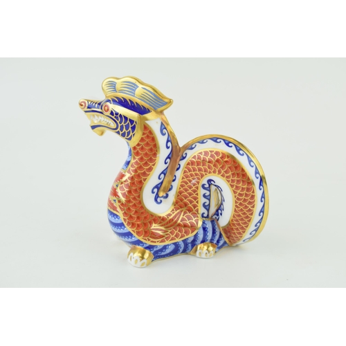 228 - Royal Crown Derby Dragon paperweight, decorated in the Imari pallet, silver stopper.