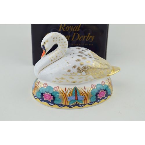 284 - Royal Crown Derby Paperweight, White Swan nesting, gold stopper and red Royal Crown Derby stamp on t... 