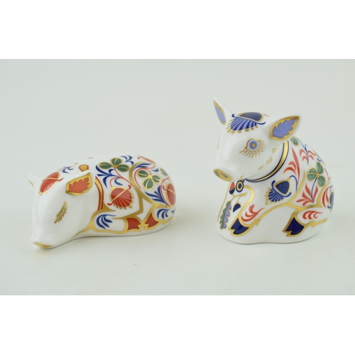 300 - Two Royal Crown Derby paperweights, Sleeping Piglet, date mark for 1999 (LXII), boxed and Sitting Pi... 