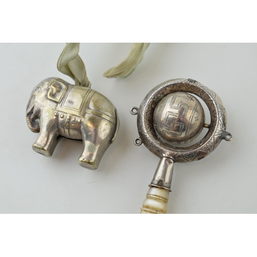 18 - A Mother of Pearl and white metal baby rattle with a plated elephant rattle (2).