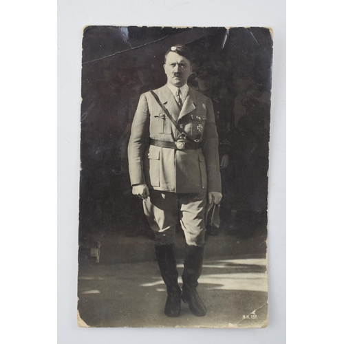 19 - An original WWII era postcard of Adolf Hitler marked to reverse Echo Photographie. Approx 8.5cm x 13... 