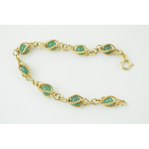 546 - 14ct gold bracelet, with enclosed jade (or similar) balls, rope effect bracelet, gross 14.4g, 18.5cm... 