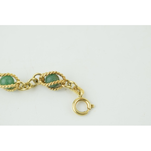 546 - 14ct gold bracelet, with enclosed jade (or similar) balls, rope effect bracelet, gross 14.4g, 18.5cm... 