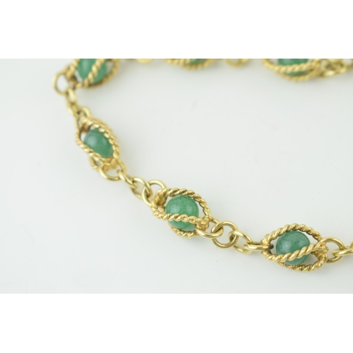 546 - 14ct gold bracelet, with enclosed jade (or similar) balls, rope effect bracelet, gross 14.4g, 18.5cm... 