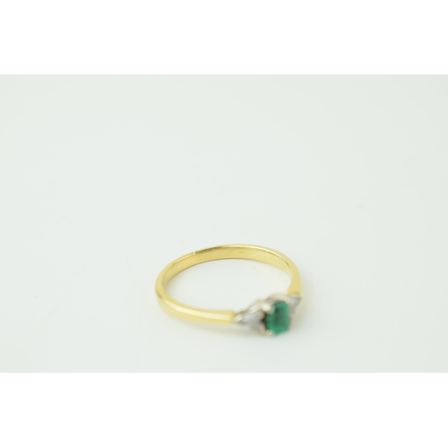 557 - 18ct yellow gold Art Deco style ring set with central baguette cut emerald and two diamonds. Ring si... 