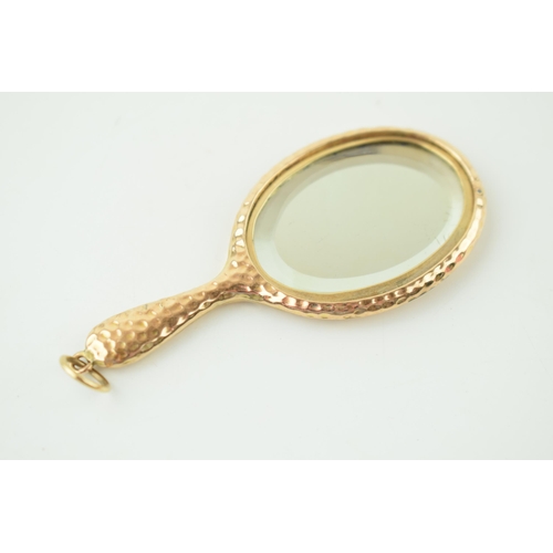 560 - A 9ct yellow gold miniature novelty mirror with chain loop. 8cm x 3.5cm. Gross weight 11.1 grams.