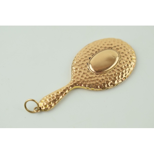 560 - A 9ct yellow gold miniature novelty mirror with chain loop. 8cm x 3.5cm. Gross weight 11.1 grams.