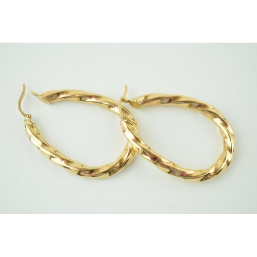 567 - A pair of 9ct yellow gold earrings. Height 4.1cm. Weight 5.6 grams.