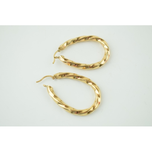 567 - A pair of 9ct yellow gold earrings. Height 4.1cm. Weight 5.6 grams.