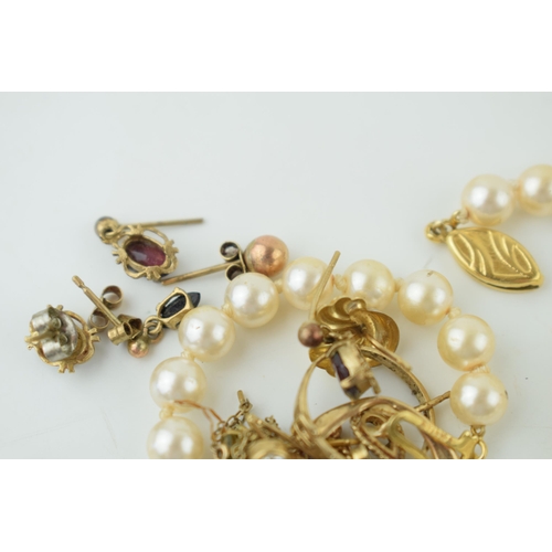 568A - A collection of yellow metal and costume jewellery t include pearls, earrings and others, some tests... 