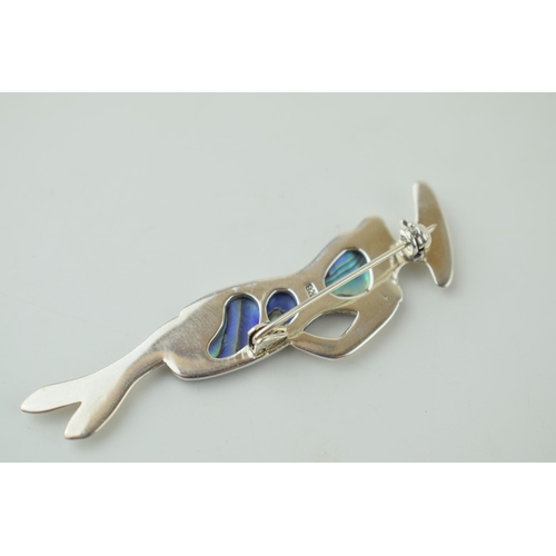 576 - A contemporary sterling silver Art Deco style brooch set with Abalone shell. Height 6.5cm.