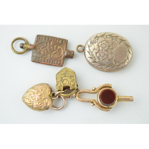 596 - A 9ct gold folding watch key, set bloodstone and agate, with a yellow metal heart pendant stamped 10... 