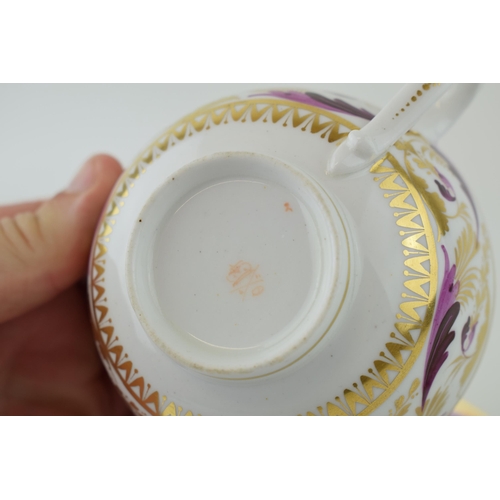 106 - Royal Crown Derby cup, saucer and coffee can in the Puce Swirl design, circa 1806-1825 (3).