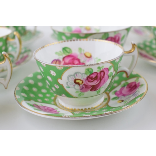 108 - An antique set of staffordshire pottery tea ware, decorated in pink rose colours, with green backgro... 