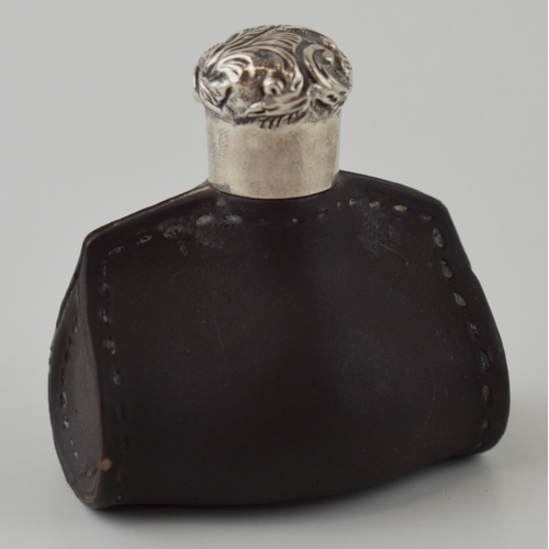 109 - Doulton Lambeth leather ware scent bottle in the form of a purse, silver screw top lid, 4.5cm wide.