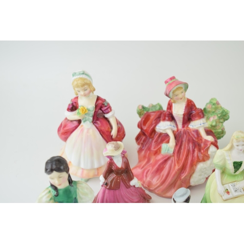 123 - A collection of Royal Doulton figures to include, 'Fair Maiden' H.N. 2211, 'Francine' H.N. 2422, 'Ly... 