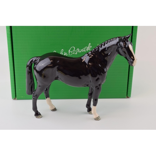 13 - Boxed Beswick 'Black Hunter Horse' issued in 2005 in a limited edition of 500. Height 21cm.