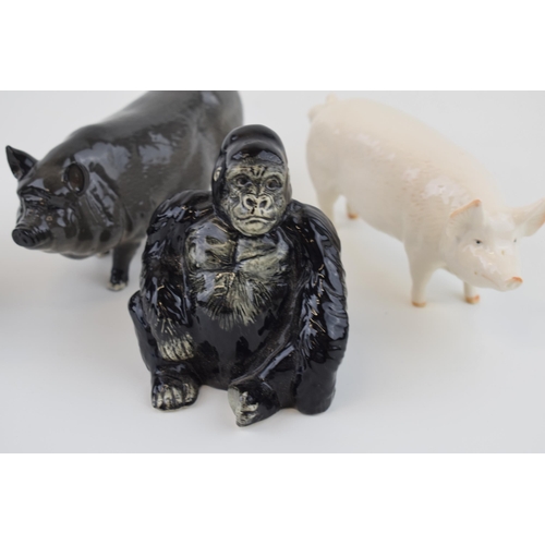 18 - A collection of Beswick and Royal Doulton figures to include Pigs, Sheltand Pony together with a Joh... 