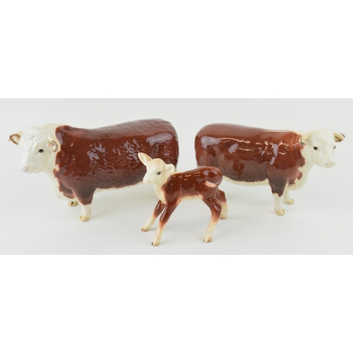 21 - Beswick cattle family to include the Hereford Bull, Hereford Cow and  Hereford Calf (3).