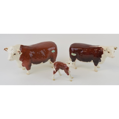 25 - Beswick cattle family to include the Hereford Bull, Hereford Cow and Hereford Calf (3).