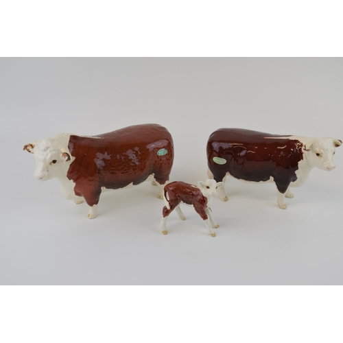 25 - Beswick cattle family to include the Hereford Bull, Hereford Cow and Hereford Calf (3).