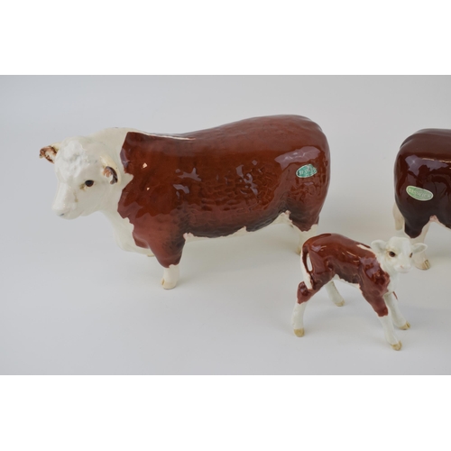 25 - Beswick cattle family to include the Hereford Bull, Hereford Cow and Hereford Calf (3).