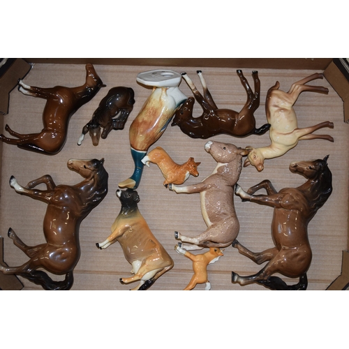 29 - A collection of damaged Beswick to include horses such as shires, Spirits, dogs, cows, donkeys and o... 