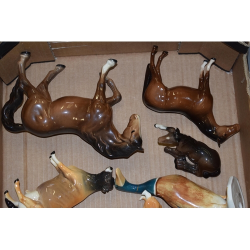 29 - A collection of damaged Beswick to include horses such as shires, Spirits, dogs, cows, donkeys and o... 