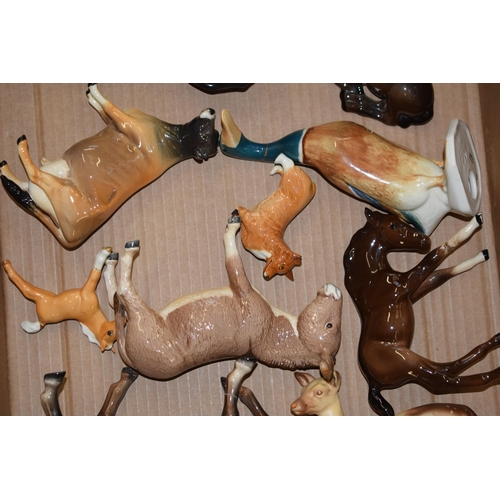 29 - A collection of damaged Beswick to include horses such as shires, Spirits, dogs, cows, donkeys and o... 