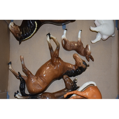 29 - A collection of damaged Beswick to include horses such as shires, Spirits, dogs, cows, donkeys and o... 