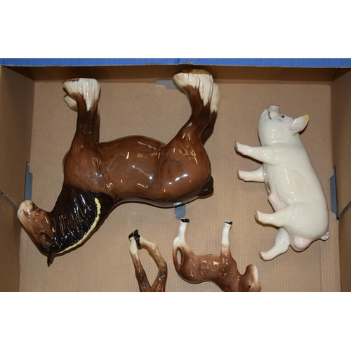 29 - A collection of damaged Beswick to include horses such as shires, Spirits, dogs, cows, donkeys and o... 