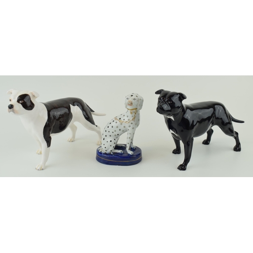 34 - John Beswick pair of bulldogs with a Staffordshire type dog (3).