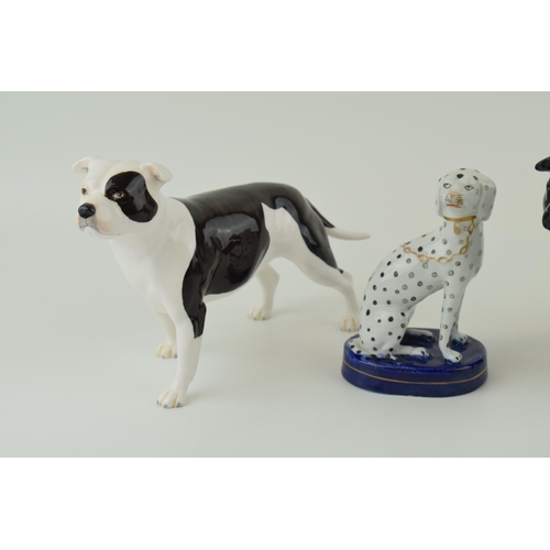 34 - John Beswick pair of bulldogs with a Staffordshire type dog (3).