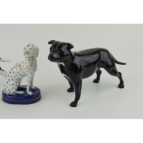 34 - John Beswick pair of bulldogs with a Staffordshire type dog (3).