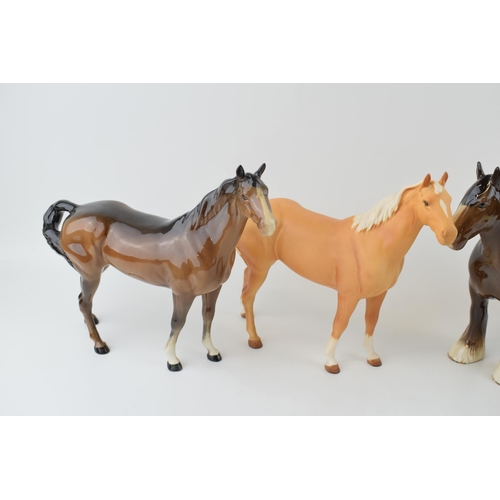 35 - Beswick horses to include a brown shire horse, a matte palomino swishtail, a brown swishtail and a b... 