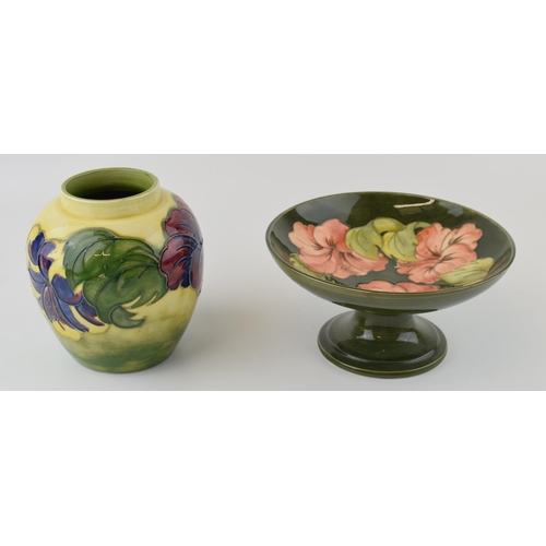 45 - Moorcroft footed bowl in the Hibiscus pattern together with a ginger jar, Height 15cm. (2)