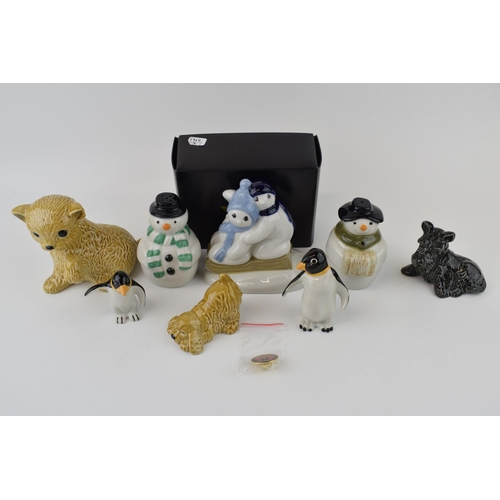 52 - A collection of Wade novelty figures to include boxed pair of Penguins Cats and Dogs Snowmen cruet s... 