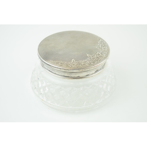 527 - Hallmarked silver topped dressing table glass jar, floral decoration with engine turned design, Birm... 