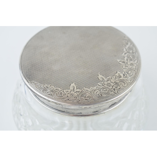 527 - Hallmarked silver topped dressing table glass jar, floral decoration with engine turned design, Birm... 