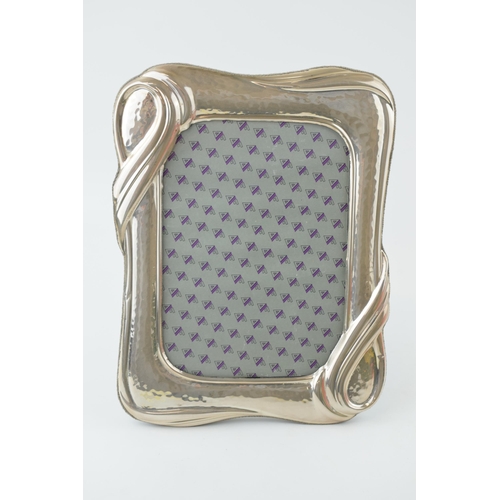 530 - Silver Art Nouveau photo frame, easel back, hammered effect, continental, 25cm tall.