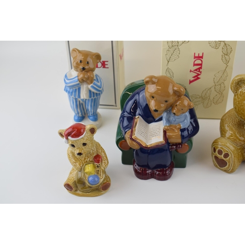 54 - A collection of Wade Teddy Bear figures to include boxed Money Box, and limited edited Baby Bear col... 