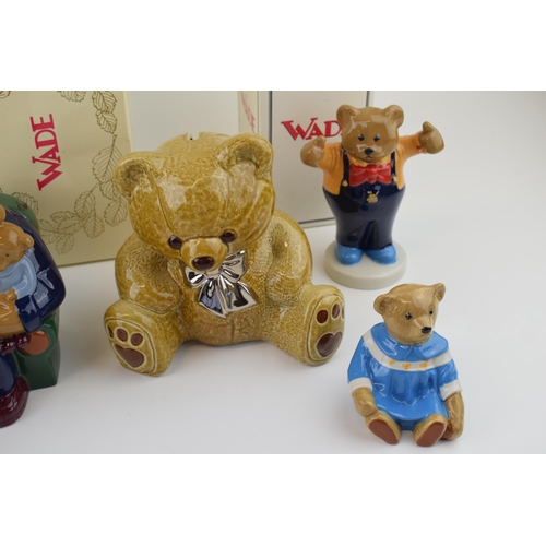 54 - A collection of Wade Teddy Bear figures to include boxed Money Box, and limited edited Baby Bear col... 