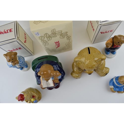 54 - A collection of Wade Teddy Bear figures to include boxed Money Box, and limited edited Baby Bear col... 