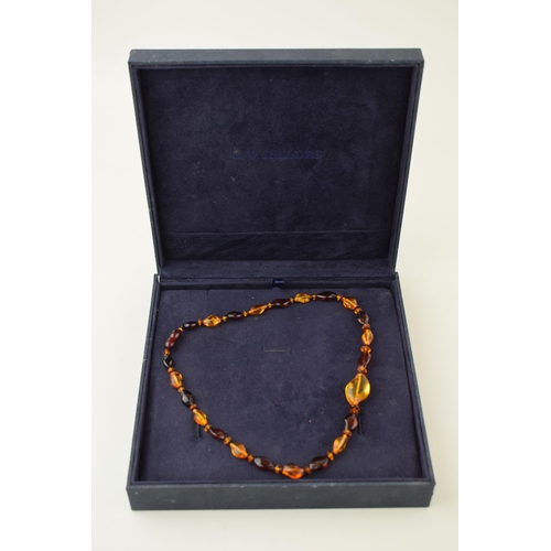 543 - Amber necklace, graduated size and colours, 10.0g, in presentation box, 43cm long.