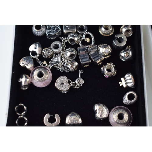 544 - Pandora: a collection of Pandora to include two bracelets and over 20 charms of varying styles and d... 